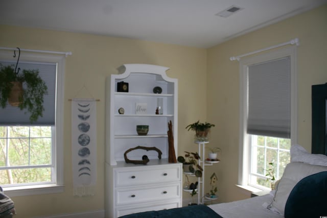 bedroom featuring visible vents