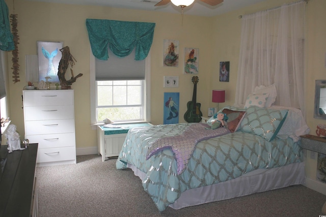 bedroom with visible vents, carpet flooring, and ceiling fan