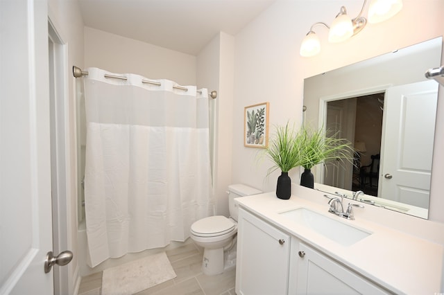 bathroom with vanity, shower / tub combo with curtain, and toilet