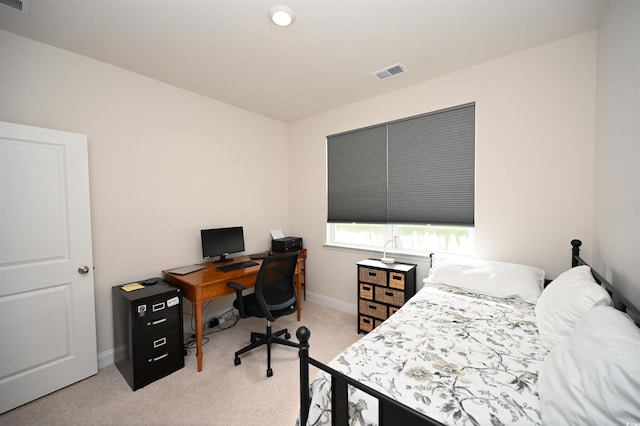bedroom featuring light colored carpet, baseboards, and visible vents