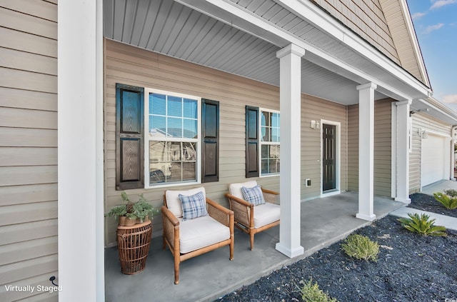 view of patio with covered porch and an attached garage