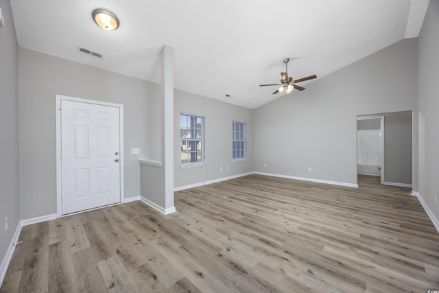 entrance foyer with wood finished floors, a ceiling fan, visible vents, baseboards, and vaulted ceiling