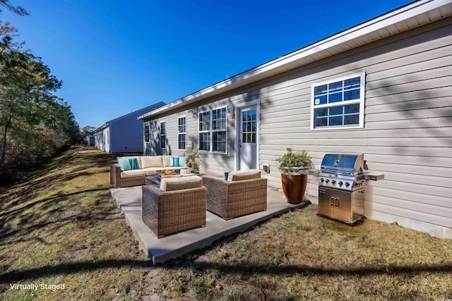 rear view of house with a patio area and outdoor lounge area
