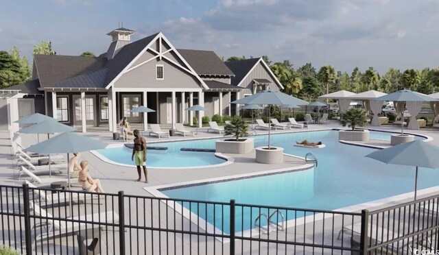 pool with a patio area and fence