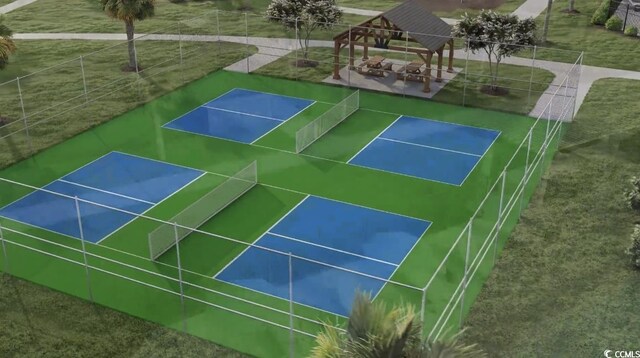 view of tennis court featuring a gazebo and fence