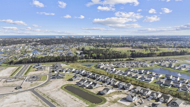 aerial view with a water view and a residential view