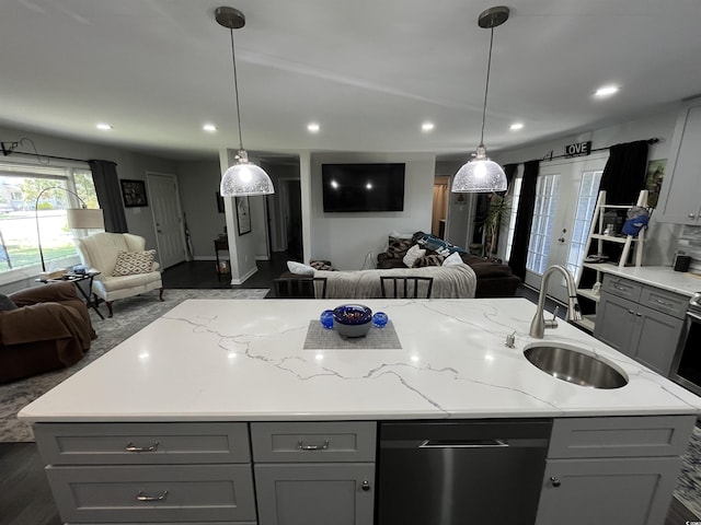 710 62nd Ave N, Myrtle Beach, SC 29572 - kitchen featuring open floor plan, a sink, dishwashing machine, gray cabinetry, and a center island with sink