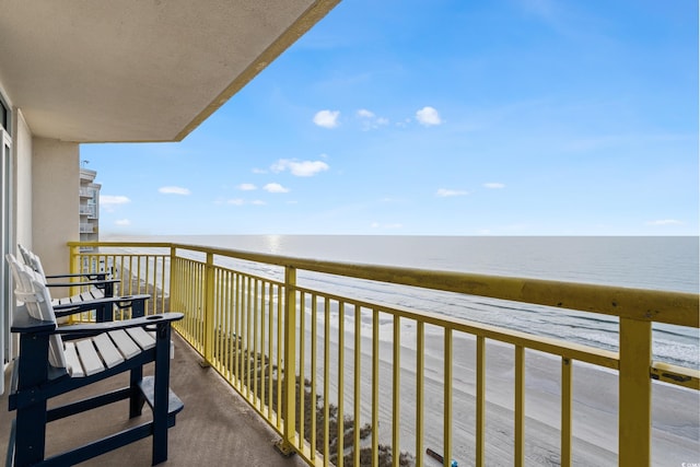 balcony featuring a water view