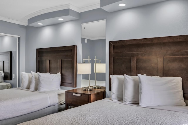 bedroom featuring crown molding and recessed lighting