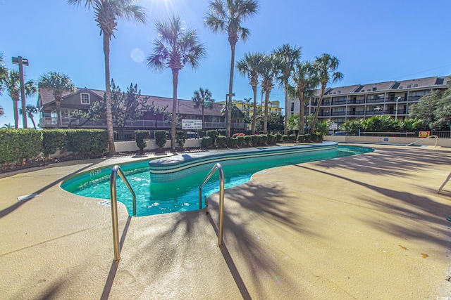 200 76th Ave N Unit 1211, Myrtle Beach, SC 29572 - community pool with a patio area and fence