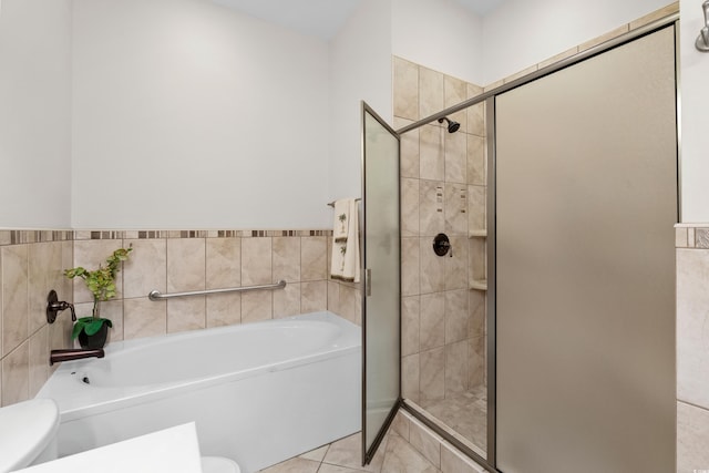 5628 Marion Cir, Myrtle Beach, SC 29577 - bathroom with toilet, a stall shower, a garden tub, and tile patterned floors