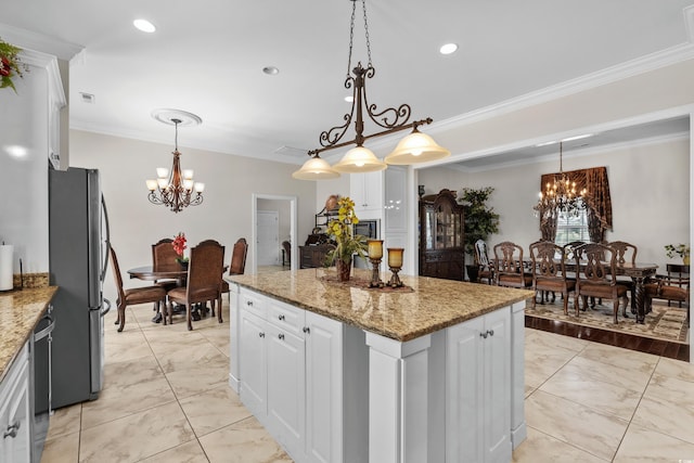 5628 Marion Cir, Myrtle Beach, SC 29577 - kitchen featuring a chandelier, stainless steel appliances, light marble finish floors, a kitchen island, and ornamental molding