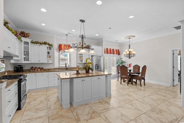 5628 Marion Cir, Myrtle Beach, SC 29577 - kitchen featuring stainless steel appliances, open shelves, a center island, under cabinet range hood, and white cabinets