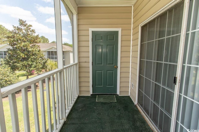 entrance to property with a balcony