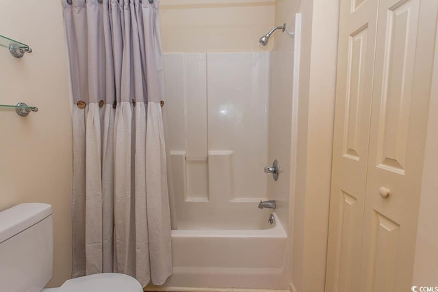full bath with shower / bath combo with shower curtain and toilet