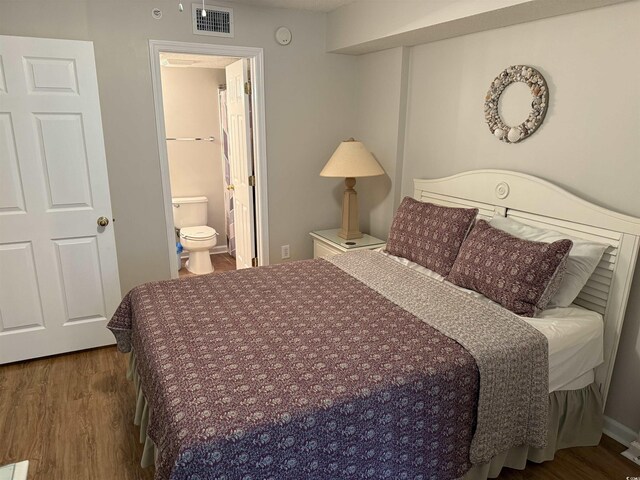 102 N Ocean Blvd Unit 903, North Myrtle Beach, SC 29582 - bedroom with wood finished floors, ensuite bathroom, and visible vents