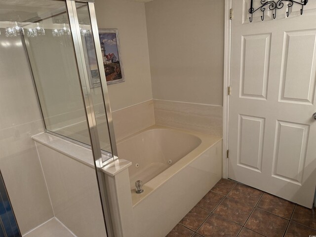 102 N Ocean Blvd Unit 903, North Myrtle Beach, SC 29582 - bathroom with a whirlpool tub, tile patterned floors, and a stall shower