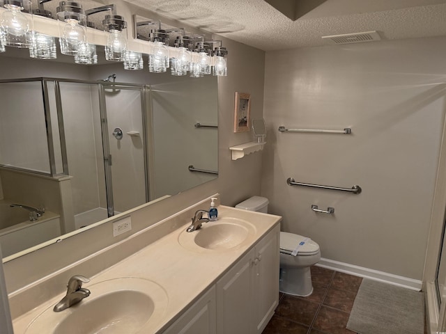 bathroom featuring toilet, a sink, a shower stall, and visible vents