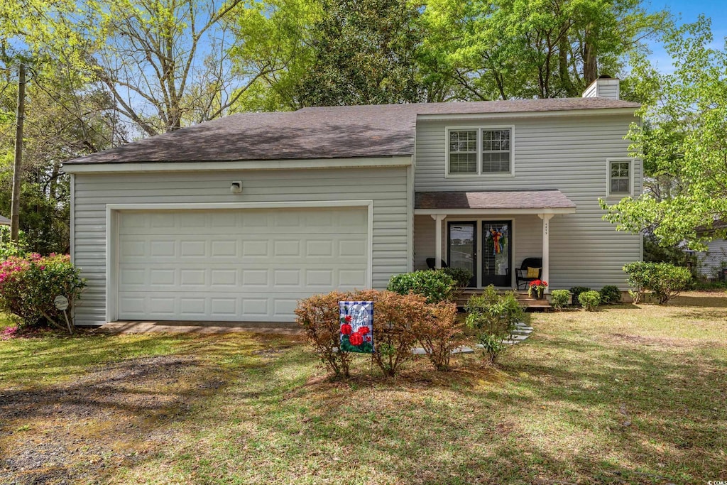 1213 Oak St, Conway, SC 29526 - traditional-style home with roof with shingles, a chimney, driveway, a front yard, and a garage