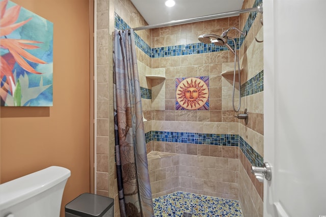 full bath with a shower stall, toilet, and recessed lighting