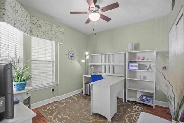 bedroom with baseboards, wood finished floors, and a ceiling fan