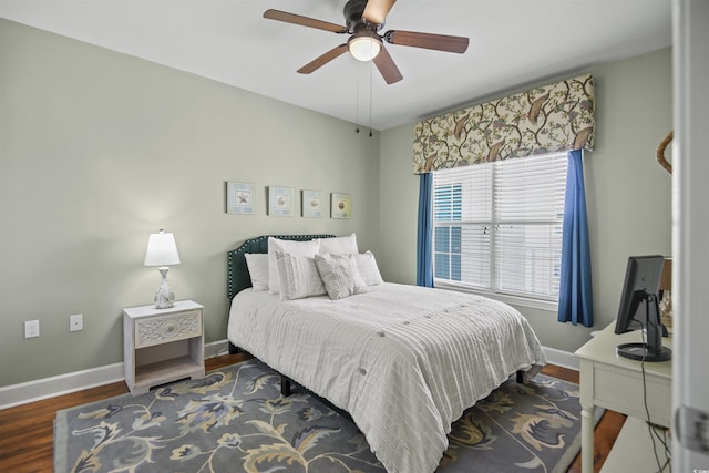 bedroom with wood finished floors, baseboards, and a ceiling fan