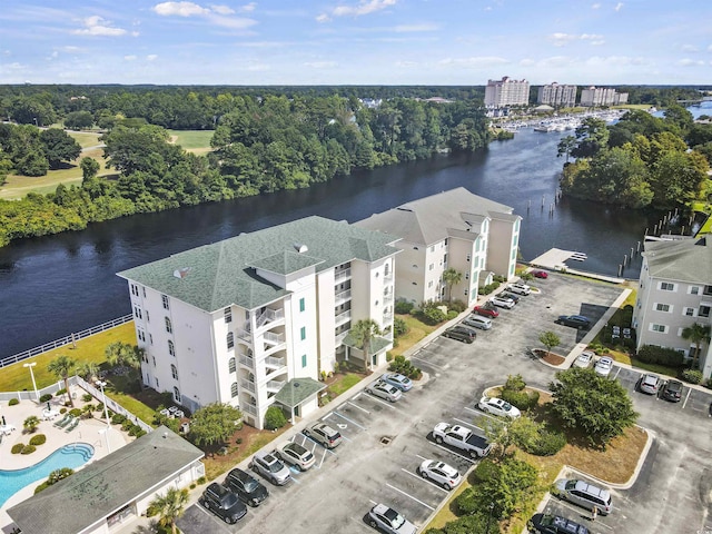 drone / aerial view of a nearby body of water and apartment complex
