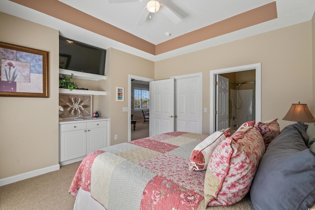bedroom with light colored carpet, baseboards, and ceiling fan
