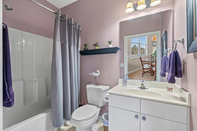 bathroom featuring shower / tub combo, toilet, and vanity