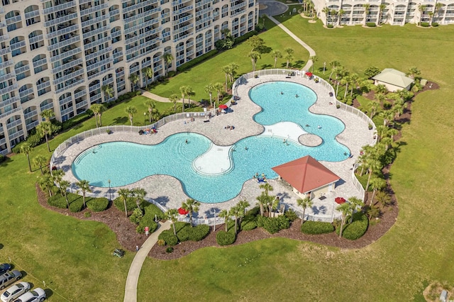 view of property location featuring a pool area