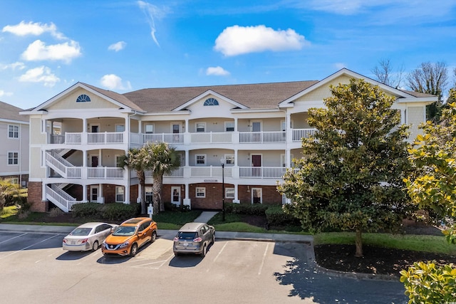 view of property featuring uncovered parking