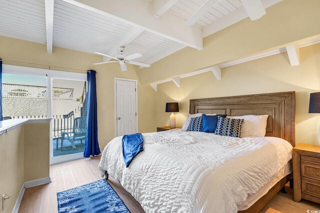 bedroom with light wood-type flooring, access to exterior, ceiling fan, and vaulted ceiling with beams