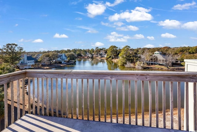 wooden deck with a water view