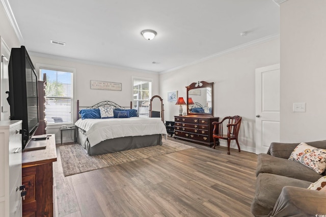 1101 Bronwyn Cir N, Myrtle Beach, SC 29582 - bedroom with wood finished floors, multiple windows, ornamental molding, and baseboards
