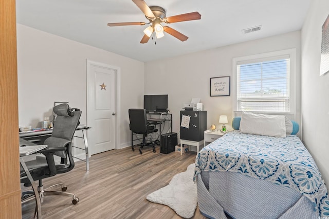 1101 Bronwyn Cir N, Myrtle Beach, SC 29582 - bedroom with wood finished floors, a desk, and a ceiling fan