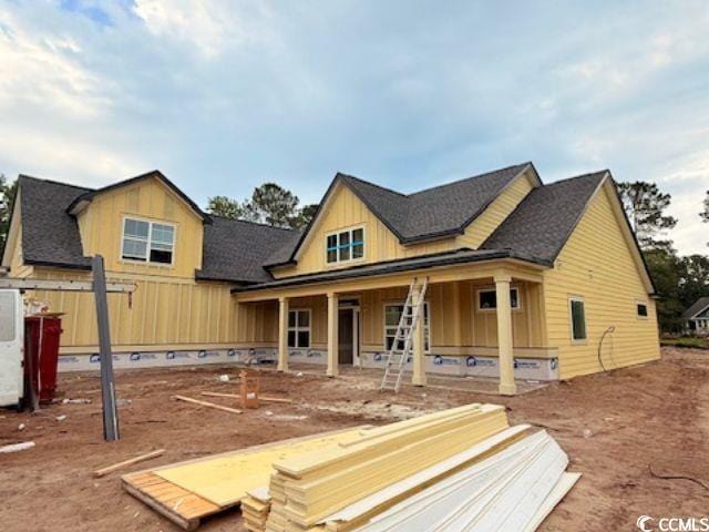 804 Edisto Ct, Myrtle Beach, SC 29588 - view of front of property featuring board and batten siding, a porch, and roof with shingles
