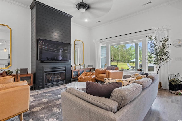 804 Edisto Ct, Myrtle Beach, SC 29588 - living area with ceiling fan, crown molding, a fireplace, wood finished floors, and recessed lighting