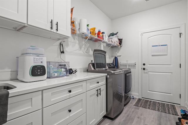 804 Edisto Ct, Myrtle Beach, SC 29588 - laundry room featuring cabinet space, separate washer and dryer, and wood finished floors