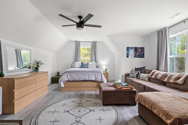 804 Edisto Ct, Myrtle Beach, SC 29588 - bedroom with light wood-style flooring, vaulted ceiling, and ceiling fan