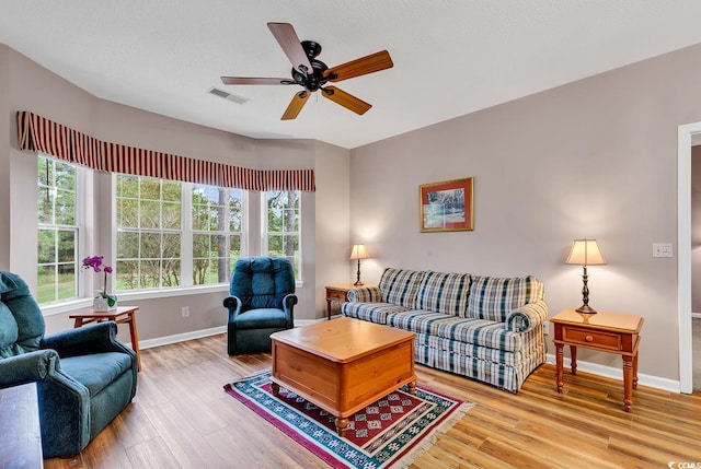4608 Arran Ct Unit E, Myrtle Beach, SC 29579 - living room with healthy amount of natural light, baseboards, and wood finished floors