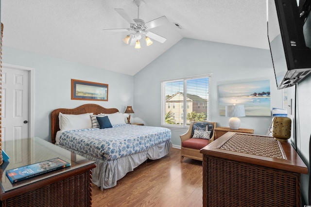 213-A 16th Ave S, Surfside Beach, SC 29575 - bedroom featuring ceiling fan, a textured ceiling, high vaulted ceiling, wood finished floors, and visible vents