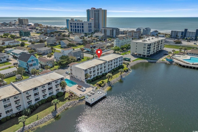 bird's eye view featuring a water view and a city view