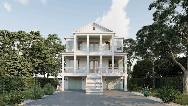 914 Perrin Dr, North Myrtle Beach, SC 29582 - view of front facade with a balcony, stairway, a garage, french doors, and driveway