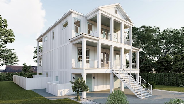 914 Perrin Dr, North Myrtle Beach, SC 29582 - view of front of house with a balcony, stairs, a porch, concrete driveway, and an attached garage