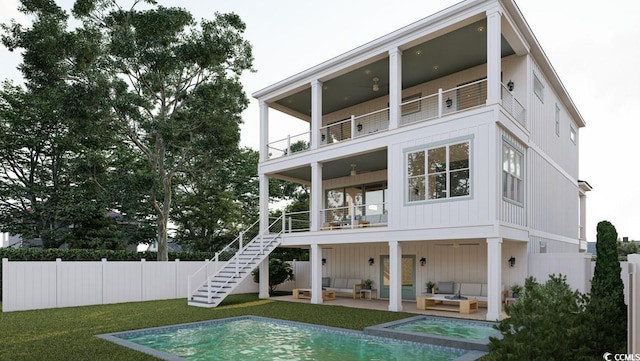 914 Perrin Dr, North Myrtle Beach, SC 29582 - back of property with a balcony, outdoor lounge area, stairway, and a patio area