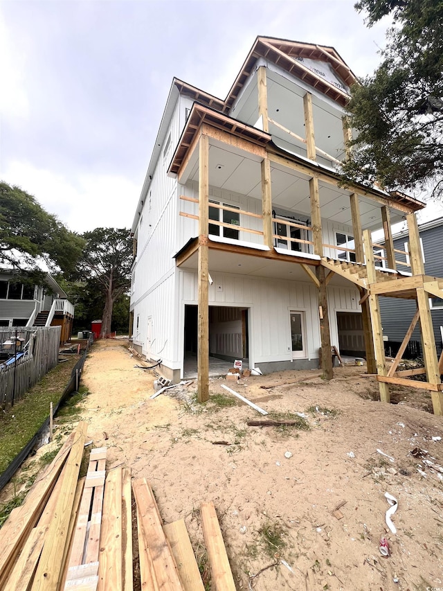 914 Perrin Dr, North Myrtle Beach, SC 29582 - back of property with a garage, driveway, and board and batten siding