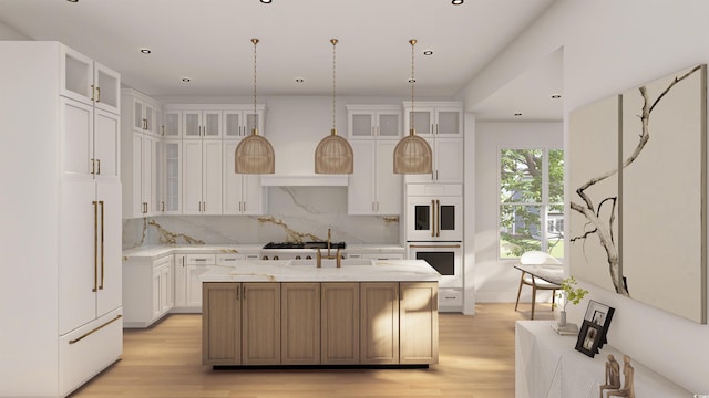 914 Perrin Dr, North Myrtle Beach, SC 29582 - kitchen with double oven, a center island with sink, light wood finished floors, tasteful backsplash, and recessed lighting