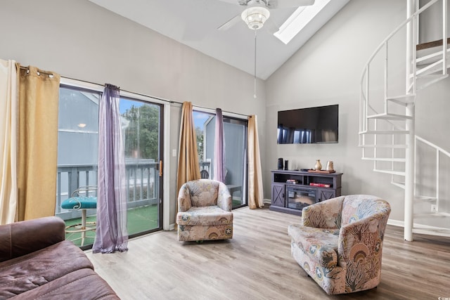 1851 Colony Dr Unit 6J, Myrtle Beach, SC 29575 - living room with stairs, ceiling fan, wood finished floors, high vaulted ceiling, and a skylight