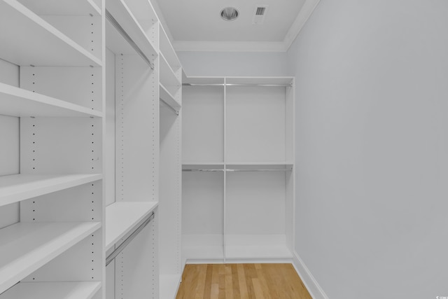 spacious closet with wood finished floors