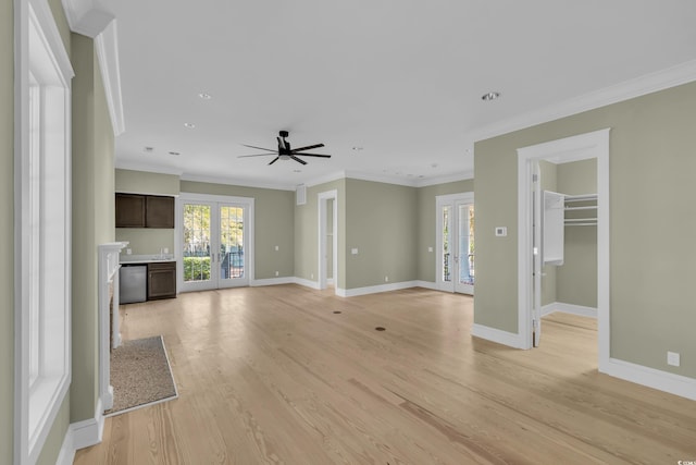 unfurnished living room with french doors, light wood finished floors, and plenty of natural light